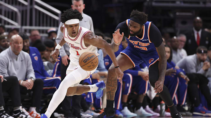 Mar 31, 2026; Houston, Texas, USA; Houston Rockets forward Amen Thompson (1) attempts to get control of the ball away from New York Knicks center/forward Mitchell Robinson (23) during the third quarter at Toyota Center. Mandatory Credit: Troy Taormina-Imagn Images