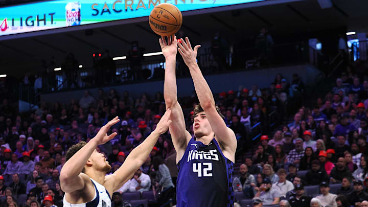 Dec 27, 2025; Sacramento, California, USA; Sacramento Kings center Maxime Raynaud (42) shoots the ball against Dallas Mavericks center Dwight Powell (7) during the third quarter at Golden 1 Center.