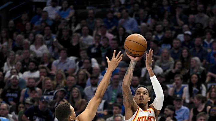Apr 4, 2024; Dallas, Texas, USA; Atlanta Hawks guard Dejounte Murray (5) makes a jump shot over Apr 4, 2024; Dallas, Texas, USA; Atlanta Hawks guard Dejounte Murray (5) makes a jump shot over