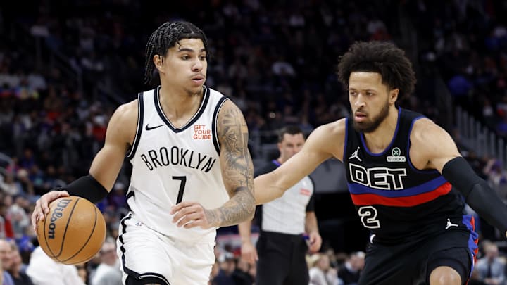 Mar 1, 2025; Detroit, Michigan, USA;  Brooklyn Nets guard Killian Hayes (7) dribbles defended by Detroit Pistons guard Cade Cunningham (2) in the first half at Little Caesars Arena. Mandatory Credit: Rick Osentoski-Imagn Images
