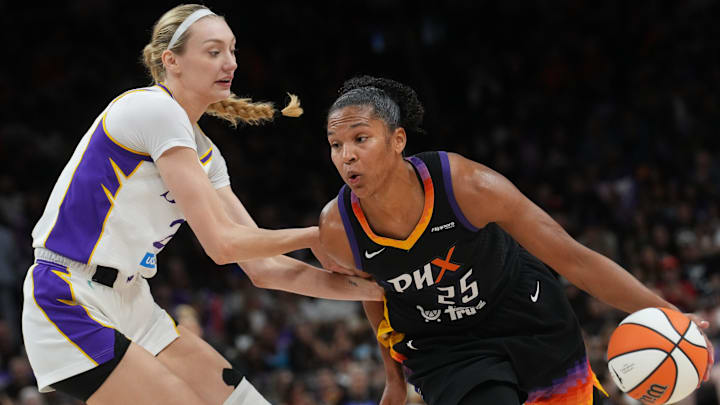 Phoenix Mercury forward Alyssa Thomas (25) drives past Los Angeles Sparks forward Cameron Brink (22) at PHX Arena on Sept. 9, 2025.