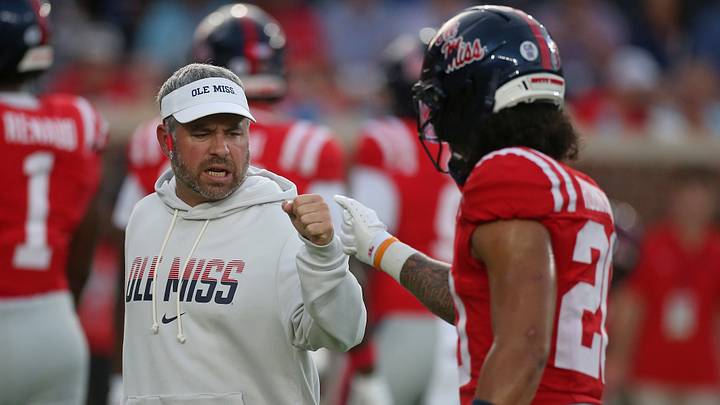 Sep 12, 2026; Oxford, Mississippi, USA; Mississippi Rebels Head Coach Pete Golding reacts with Mississippi Rebels safety Anthony Robinson III (20) during warm ups prior to the game against the Charlotte 49ers at Vaught-Hemingway Stadium. Mandatory Credit: Petre Thomas-Imagn Images Sep 12, 2026; Oxford, Mississippi, USA; Mississippi Rebels Head Coach Pete Golding reacts with Mississippi Rebels safety Anthony Robinson III (20) during warm ups prior to the game against the Charlotte 49ers at Vaught-Hemingway Stadium. Mandatory Credit: Petre Thomas-Imagn Images