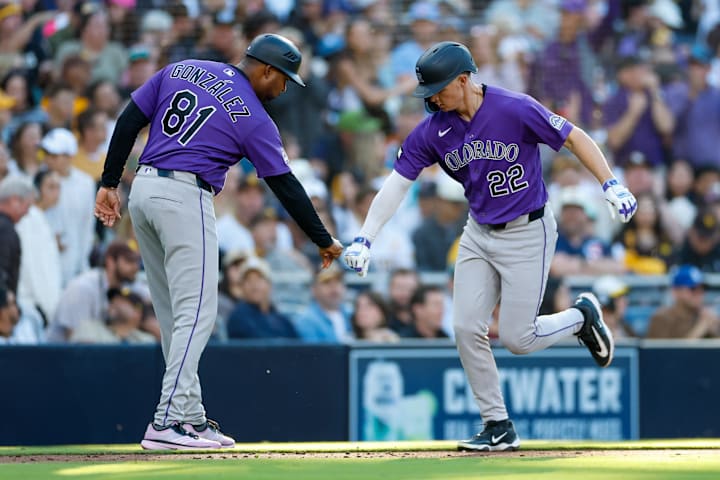 Colorado Rockies right fielder Mickey Moniak and third base coach Andy Gonzalez 