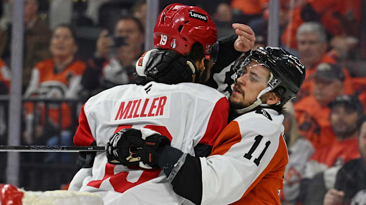 May 7, 2026; Philadelphia, Pennsylvania, USA; Philadelphia Flyers right wing Travis Konecny (11) battles wit Carolina Hurricanes defenseman K'andre Miller (19) during the third period in game three of the second round of the 2026 Stanley Cup Playoffs at Xfinity Mobile Arena. Mandatory Credit: Eric Hartline-Imagn Images
