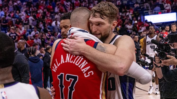 Apr 19, 2024; New Orleans, Louisiana, USA;   New Orleans Pelicans center Jonas Valanciunas (17) hugs Sacramento Kings forward Domantas Sabonis (10) after time expires during a play-in game of the 2024 NBA playoffs at Smoothie King Center. Mandatory Credit: Stephen Lew-Imagn Images