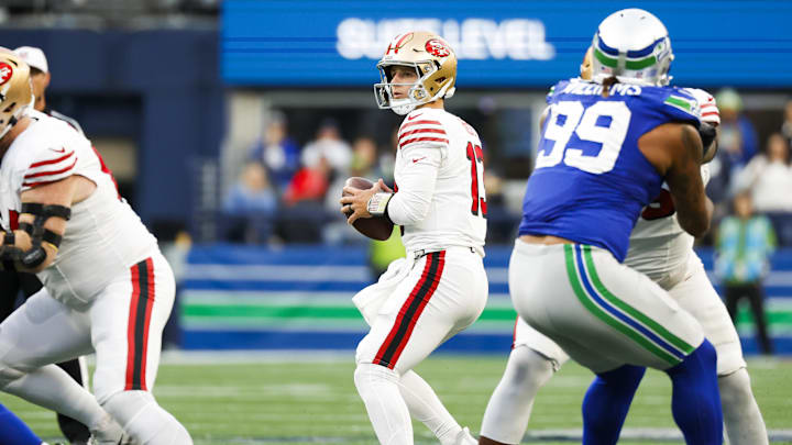 Oct 10, 2024; Seattle, Washington, USA; San Francisco 49ers quarterback Brock Purdy (13) looks to pass against the Seattle Seahawks during the second quarter at Lumen Field. Mandatory Credit: Joe Nicholson-Imagn Images Oct 10, 2024; Seattle, Washington, USA; San Francisco 49ers quarterback Brock Purdy (13) looks to pass against the Seattle Seahawks during the second quarter at Lumen Field. Mandatory Credit: Joe Nicholson-Imagn Images