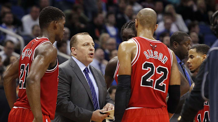 Jan 15, 2014; Orlando, FL, USA; Chicago Bulls head coach Tom Thibodeau talks with shooting guard Jimmy Butler (21) and power forward Taj Gibson (22) against the Orlando Magic during the second half at Amway Center. Chicago Bulls defeated the Orlando Magic 128-125. Mandatory Credit: Kim Klement-Imagn Images