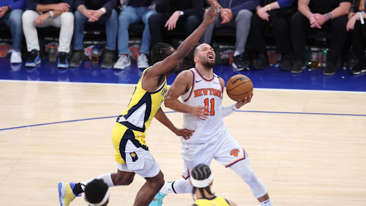 New York Knicks guard Jalen Brunson controls the ball against Indiana Pacers forward Aaron Nesmith. Mandatory Credit: Wendell Cruz-Imagn Images