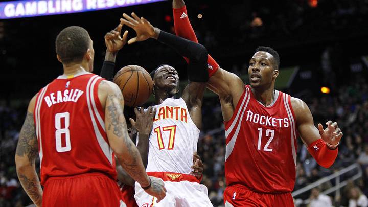 Mar 19, 2016; Atlanta, GA, USA; Atlanta Hawks guard Dennis Schroder (17) is defended by Houston Rockets forward Michael Beasley (8) and center Dwight Howard (12) in the fourth quarter at Philips Arena. The Hawks defeated the Rockets 109-97. Mandatory Credit: Brett Davis-Imagn Images Mar 19, 2016; Atlanta, GA, USA; Atlanta Hawks guard Dennis Schroder (17) is defended by Houston Rockets forward Michael Beasley (8) and center Dwight Howard (12) in the fourth quarter at Philips Arena. The Hawks defeated the Rockets 109-97. Mandatory Credit: Brett Davis-Imagn Images