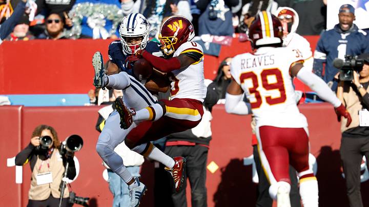 Dec 25, 2025; Landover, Maryland, USA; Washington Commanders cornerback Mike Sainristil (0) breaks up a pass intended for Dallas Cowboys wide receiver Jalen Tolbert (1) in the end zone during the first half at Northwest Stadium. Mandatory Credit: Geoff Burke-Imagn Images Dec 25, 2025; Landover, Maryland, USA; Washington Commanders cornerback Mike Sainristil (0) breaks up a pass intended for Dallas Cowboys wide receiver Jalen Tolbert (1) in the end zone during the first half at Northwest Stadium. Mandatory Credit: Geoff Burke-Imagn Images