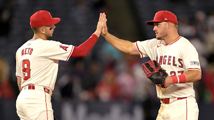 Apr 8, 2024; Anaheim, California, USA; Los Angeles Angels shortstop Zach Neto (9) high fives outfielder Mike Trout (27) after the final out of the ninth inning against the Tampa Bay Rays at Angel Stadium. Mandatory Credit: Jayne Kamin-Oncea-Imagn Images