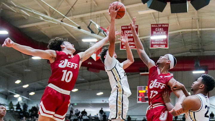 Noblesville Millers guard Justin Curry II (10) grabs a rebound Saturday, Dec. 14, 2024, during an Indiana High School Basketball FORUM Tipoff Classic game between Noblesville and Jeffersonville at Southport Fieldhouse in Indianapolis.