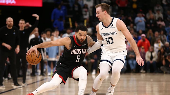 Jan 9, 2025; Memphis, Tennessee, USA; Houston Rockets guard Fred VanVleet (5) dribbles as Memphis Grizzlies guard Luke Kennard (10) defends during the fourth quarter at FedExForum. Mandatory Credit: Petre Thomas-Imagn Images