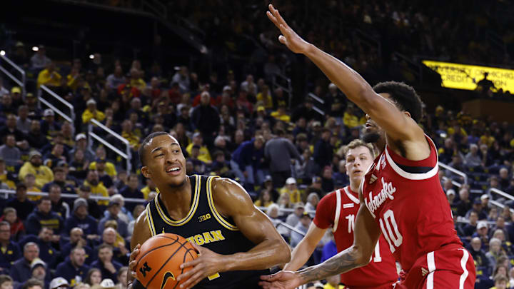 Jan 27, 2026; Ann Arbor, Michigan, USA; Michigan Wolverines guard Nimari Burnett (4) is defended by Nebraska Cornhuskers guard Jamarques Lawrence (10) in the first half at Crisler Center. Mandatory Credit: Rick Osentoski-Imagn Images Jan 27, 2026; Ann Arbor, Michigan, USA; Michigan Wolverines guard Nimari Burnett (4) is defended by Nebraska Cornhuskers guard Jamarques Lawrence (10) in the first half at Crisler Center. Mandatory Credit: Rick Osentoski-Imagn Images