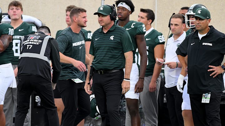 Aug 30, 2024; East Lansing, Michigan, USA;  New Michigan State Spartans head coach Jonathan Smith watches from the sidelines during the game against the Florida Atlantic Owls at Spartan Stadium. Mandatory Credit: Dale Young-USA TODAY Sports