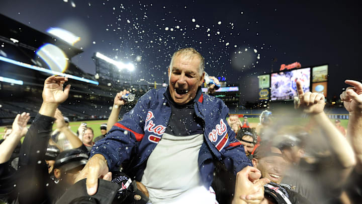 October 3, 2010; Atlanta, GA, USA; Atlanta Braves manager Bobby Cox (6) gets hoisted on the shoulders of his players as they celebrate on the field following San Francisco Giants victory over San Diego Padres allowing the Braves to clinch the wildcard after defeating the Philadelphia Phillies earlier 8-7 at Turner Field. Mandatory Credit: John David Mercer-Imagn Images