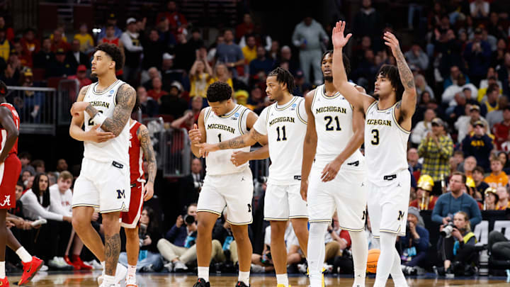 Mar 27, 2026; Chicago, IL, USA; Michigan Wolverines guard Elliot Cadeau (3) reacts with teammates in the second half against the Alabama Crimson Tide during a Sweet Sixteen game of the Midwest Regional of the men's 2026 NCAA Tournament at United Center. Mandatory Credit: Kamil Krzaczynski-Imagn Images Mar 27, 2026; Chicago, IL, USA; Michigan Wolverines guard Elliot Cadeau (3) reacts with teammates in the second half against the Alabama Crimson Tide during a Sweet Sixteen game of the Midwest Regional of the men's 2026 NCAA Tournament at United Center. Mandatory Credit: Kamil Krzaczynski-Imagn Images