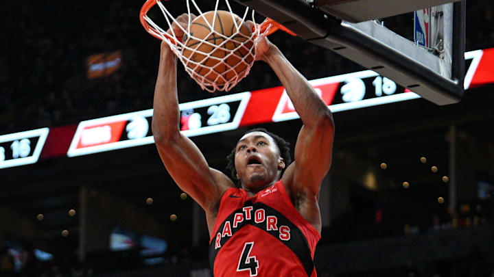 Oct 25, 2024; Toronto, Ontario, CAN;  Toronto Raptors forward Scottie Barnes (4) dunks for a basket against the Philadelphia 76ers in the second half at Scotiabank Arena. Mandatory Credit: Dan Hamilton-Imagn Images