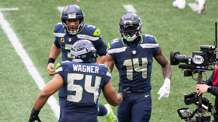 Jan 9, 2021; Seattle, Washington, USA; Seattle Seahawks wide receiver DK Metcalf (14) celebrates with quarterback Russell Wilson (3) and middle linebacker Bobby Wagner (54) after Metcalf scored a touchdown against the Los Angeles Rams during the first half at Lumen Field.