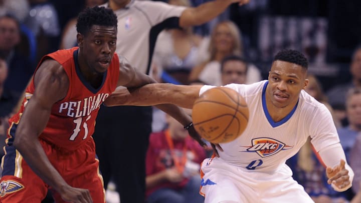 Feb 11, 2016; Oklahoma City, OK, USA; New Orleans Pelicans guard Jrue Holiday (11) steals the ball from Oklahoma City Thunder guard Russell Westbrook (0) during the first quarter at Chesapeake Energy Arena. Mandatory Credit: Mark D. Smith-Imagn Images