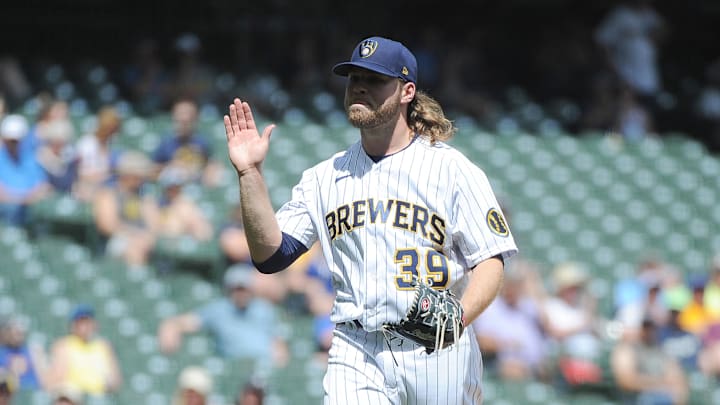 Jun 6, 2021; Milwaukee, Wisconsin, USA;  Milwaukee Brewers starting pitcher Corbin Burnes (39) celebrates getting retiring the side with two men on base for the Arizona Diamondbacks in the fifth inning at American Family Field. Mandatory Credit: Michael McLoone-Imagn Images