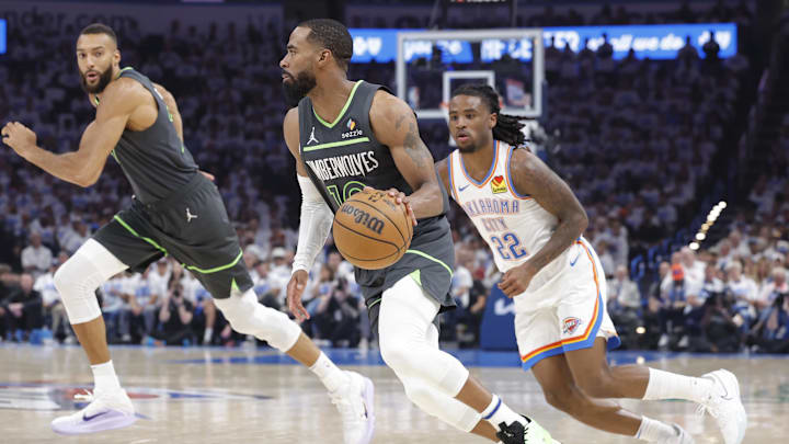 May 20, 2025; Oklahoma City, Oklahoma, USA; Minnesota Timberwolves guard Mike Conley (10) dribbles against Oklahoma City Thunder guard Cason Wallace (22) in the second quarter during game one of the western conference finals for the 2025 NBA Playoffs at Paycom Center. Mandatory Credit: Alonzo Adams-Imagn Images