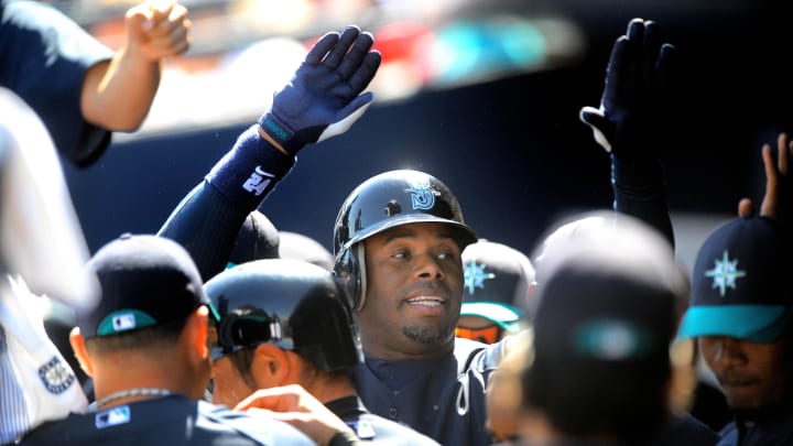 Mar. 12, 2010; Peoria, AZ, USA; Seattle Mariners designated hitter Ken Griffey Jr  is congratulated after hitting an RBI sacrifice fly in the first inning against the Kansas City Royals at Peoria Stadium. Mandatory Credit: Mark J. Rebilas-USA TODAY Sports