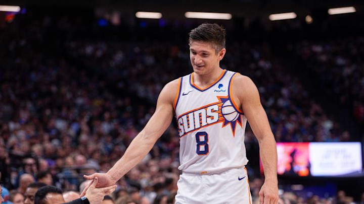 Apr 12, 2024; Sacramento, California, USA; Phoenix Suns guard Grayson Allen (8) high fives coaches as he comes out of the game during the second quarter at Golden 1 Center. Mandatory Credit: Ed Szczepanski-Imagn Images