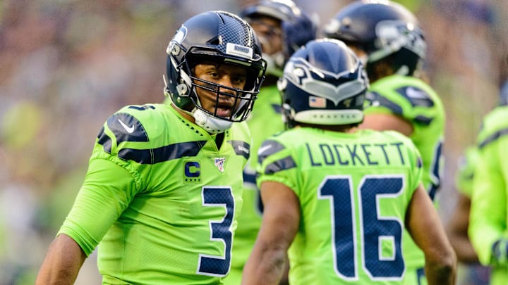 Former Seattle Seahawks quarterback Russell Wilson celebrates with receiver Tyler Lockett. Former Seattle Seahawks quarterback Russell Wilson celebrates with receiver Tyler Lockett.