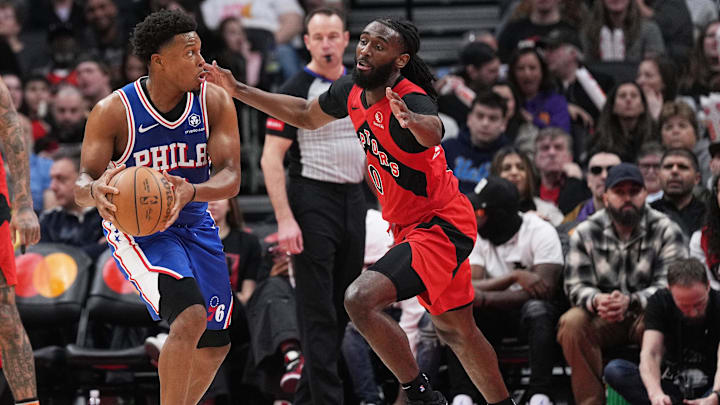 Mar 31, 2024; Toronto, Ontario, CAN; Philadelphia 76ers guard Kyle Lowry (7) controls the ball as Toronto Raptors guard Javon Freeman-Liberty (0) tries to defend during the third quarter at Scotiabank Arena. Mandatory Credit: Nick Turchiaro-Imagn Images