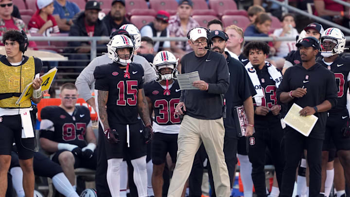 Oct 19, 2024; Stanford, California, USA; Stanford Cardinal head coach Troy Taylor (center) walks along the sideline during the first quarter against the Southern Methodist Mustangs at Stanford Stadium. Mandatory Credit: Darren Yamashita-Imagn Images