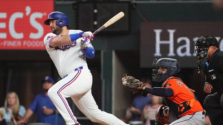 May 26, 2026; Arlington, Texas, USA; Texas Rangers first baseman Jake Burger (21) hits a two-run single against the Houston Astros during the first inning at Globe Life Field. Mandatory Credit: Raymond Carlin III-Imagn Images May 26, 2026; Arlington, Texas, USA; Texas Rangers first baseman Jake Burger (21) hits a two-run single against the Houston Astros during the first inning at Globe Life Field. Mandatory Credit: Raymond Carlin III-Imagn Images