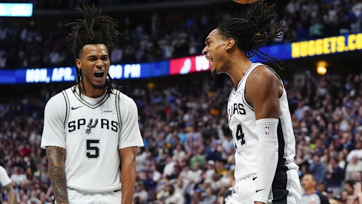 Apr 4, 2026; Denver, Colorado, USA; San Antonio Spurs guard Stephon Castle (5) and guard Devin Vassell (24) react in the fourth quarter against the Denver Nuggets at Ball Arena. Mandatory Credit: Ron Chenoy-Imagn Images