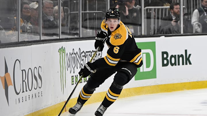 Mar 15, 2025; Boston, Massachusetts, USA; Boston Bruins defenseman Mason Lohrei (6) with the puck during the second period against the Tampa Bay Lightning at TD Garden. Mandatory Credit: Eric Canha-Imagn Images