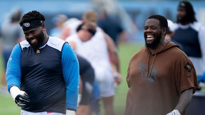 Tennessee Titans tackles Geron Christian, left, and Leroy Watson IV head off the field after practice on the second day of training camp Thursday, July 25, 2024.