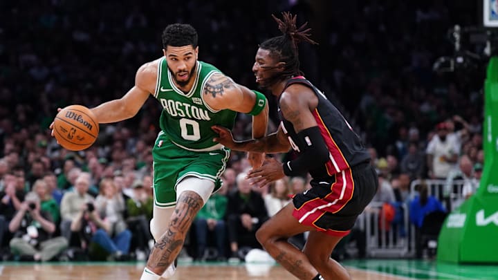 Apr 24, 2024; Boston, Massachusetts, USA; Boston Celtics forward Jayson Tatum (0) drives the ball vs. Delon Wright of the Miami Heat.