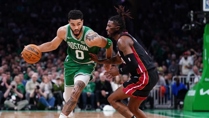 Apr 24, 2024; Boston, Massachusetts, USA; Boston Celtics forward Jayson Tatum (0) drives the ball vs. Delon Wright of the Miami Heat.
