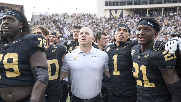 Oct 18, 2025; Nashville, Tennessee, USA;  Vanderbilt Commodores head coach Clark Lea celebrates the win with his team and the student section against the Louisiana State Tigers during the second half at FirstBank Stadium. Mandatory Credit: Steve Roberts-Imagn Images