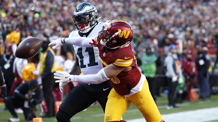 Dec 22, 2024; Landover, Maryland, USA; Washington Commanders cornerback Marshon Lattimore (23) defends a pass intended for Philadelphia Eagles wide receiver A.J. Brown (11) during the first quarter at Northwest Stadium. Mandatory Credit: Geoff Burke-Imagn Images