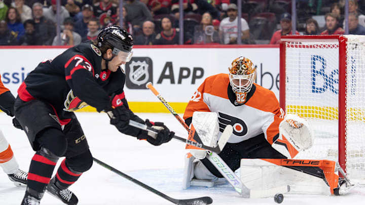 Nov 14, 2024; Ottawa, Ontario, CAN; Philadelphia Flyers goalie Ivan Fedotov (82) makes a save on a shot from Ottawa Senators left wing Noah Gregor (73) in the first period at the Canadian Tire Centre.