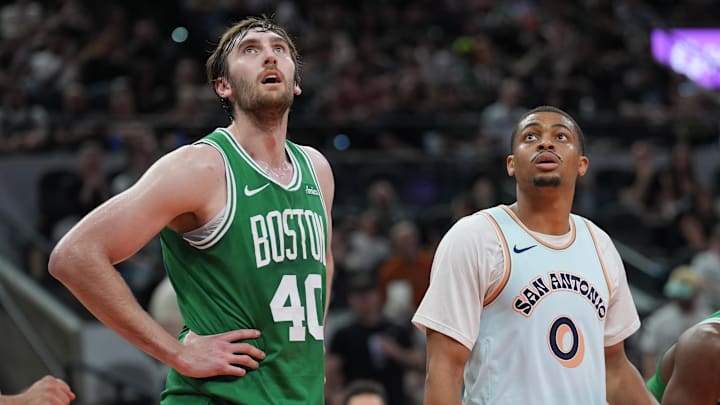 Mar 29, 2025; San Antonio, Texas, USA; Boston Celtics center Luke Kornet (40) and San Antonio Spurs forward Keldon Johnson (0) look up in the first half at Frost Bank Center. Mandatory Credit: Daniel Dunn-Imagn Images Mar 29, 2025; San Antonio, Texas, USA; Boston Celtics center Luke Kornet (40) and San Antonio Spurs forward Keldon Johnson (0) look up in the first half at Frost Bank Center. Mandatory Credit: Daniel Dunn-Imagn Images