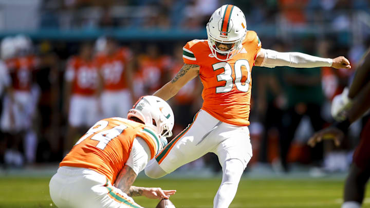 Sep 3, 2022; Miami Gardens, Florida, USA; Miami Hurricanes place kicker Andres Borregales (30) scores an extra point conversion during the first quarter against the Bethune Cookman Wildcats at Hard Rock Stadium. Mandatory Credit: Sam Navarro-Imagn Images