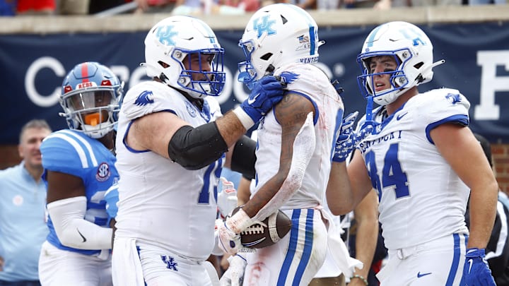 Sep 28, 2024; Oxford, Mississippi, USA; Kentucky Wildcats offensive lineman Eli Cox (75) reacts with wide receiver Dane Key (6) after a touchdown catch during the first half against the Mississippi Rebels at Vaught-Hemingway Stadium. Mandatory Credit: Petre Thomas-Imagn Images