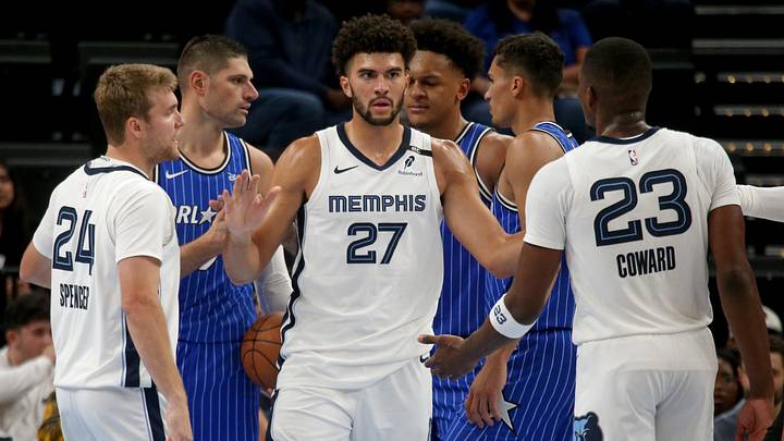 Oct 7, 2026; Memphis, Tennessee, USA; Memphis Grizzlies forward Cameron Boozer (27) reacts with guard Cam Spencer (24) and forward Cedric Coward (23) during the second quarter against the Orlando Magic at FedExForum. Mandatory Credit: Petre Thomas-Imagn Images Oct 7, 2026; Memphis, Tennessee, USA; Memphis Grizzlies forward Cameron Boozer (27) reacts with guard Cam Spencer (24) and forward Cedric Coward (23) during the second quarter against the Orlando Magic at FedExForum. Mandatory Credit: Petre Thomas-Imagn Images