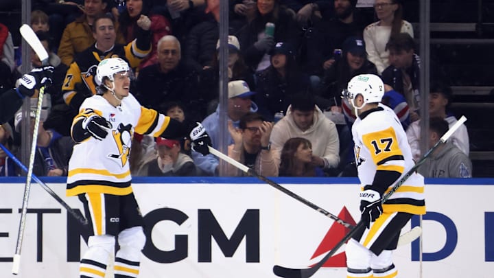 Rickard Rakell (left) celebrates with Bryan Rust (right) during Pittsburgh Penguins v New York Rangers