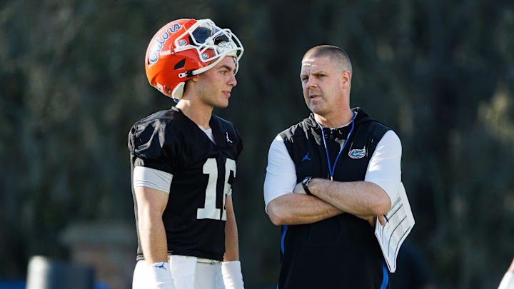 Florida Gators quarterback Aidan Warner (16) talks with Florida Gators head coach Billy Napier during spring football practice at Heavener Football Complex at the University of Florida in Gainesville, FL on Thursday, March 6, 2025. [Matt Pendleton/Gainesville Sun]