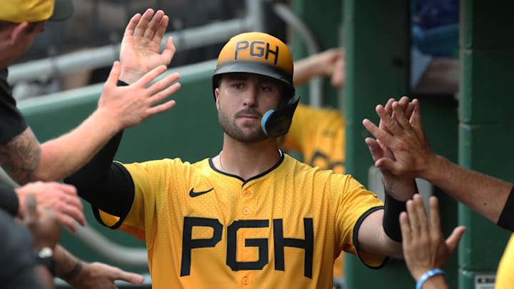 Jun 27, 2025; Pittsburgh, Pennsylvania, USA;  Pittsburgh Pirates catcher Joey Bart (14) celebrates in the dugout after scoring a run against the New York Mets during the second inning at PNC Park. Mandatory Credit: Charles LeClaire-Imagn Images