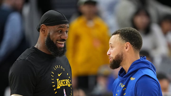 Dec 25, 2024; San Francisco, California, USA; Los Angeles Lakers forward LeBron James (left) and Golden State Warriors guard Stephen Curry (right). Mandatory Credit: Darren Yamashita-Imagn Images
