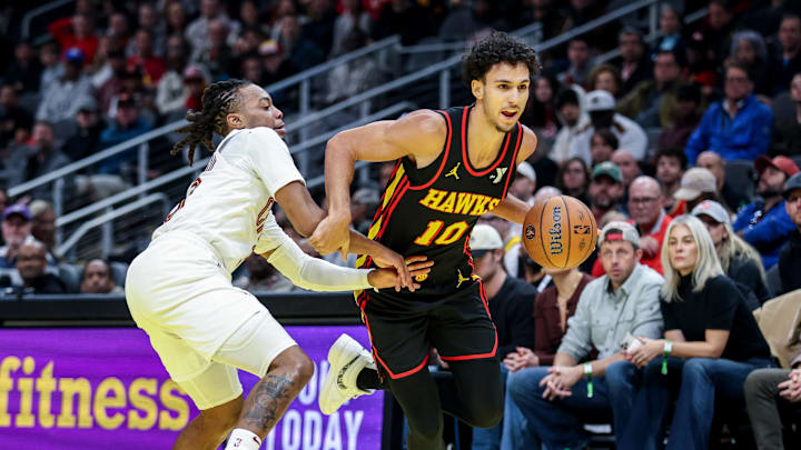 Nov 29, 2024; Atlanta, Georgia, USA; Atlanta Hawks forward Zaccharie Risacher (10) drives the ball toward the goal against Cleveland Cavaliers guard Darius Garland (10) during the first quarter at State Farm Arena. Mandatory Credit: Jordan Godfree-Imagn Images Nov 29, 2024; Atlanta, Georgia, USA; Atlanta Hawks forward Zaccharie Risacher (10) drives the ball toward the goal against Cleveland Cavaliers guard Darius Garland (10) during the first quarter at State Farm Arena. Mandatory Credit: Jordan Godfree-Imagn Images