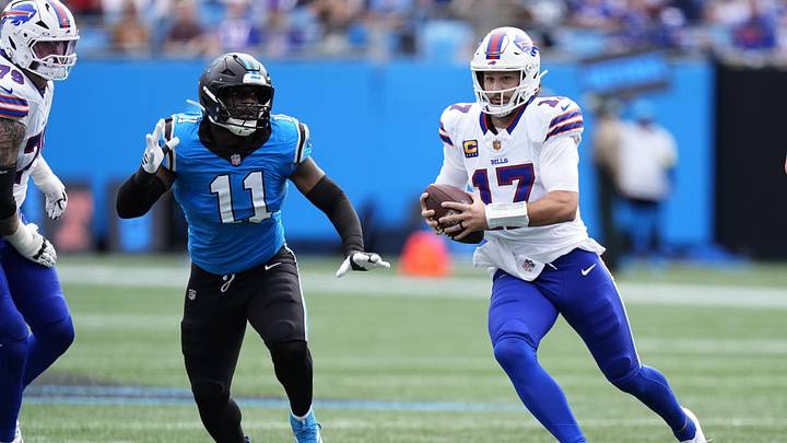 Oct 26, 2025; Charlotte, North Carolina, USA; Buffalo Bills quarterback Josh Allen (17) scrambles against Carolina Panthers linebacker Nic Scourton (11) during the first half at Bank of America Stadium. Mandatory Credit: Jim Dedmon-Imagn Images Oct 26, 2025; Charlotte, North Carolina, USA; Buffalo Bills quarterback Josh Allen (17) scrambles against Carolina Panthers linebacker Nic Scourton (11) during the first half at Bank of America Stadium. Mandatory Credit: Jim Dedmon-Imagn Images